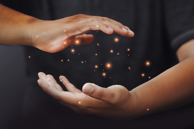 People's hands on black background