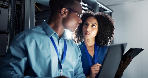people server room and working or coding with tablet teamwork and firmware installation or system programming network database and it technician together bigdata and software infrastructure