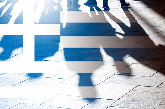 People shadows and flag of Greece