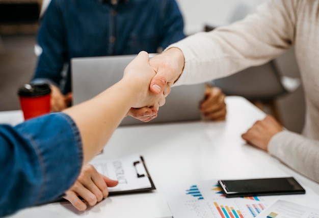 People shaking hands after a business discussion