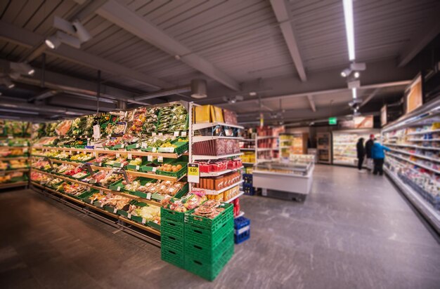 people shopping in modern supermarket