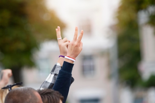 People show victory sign at protests or rallies