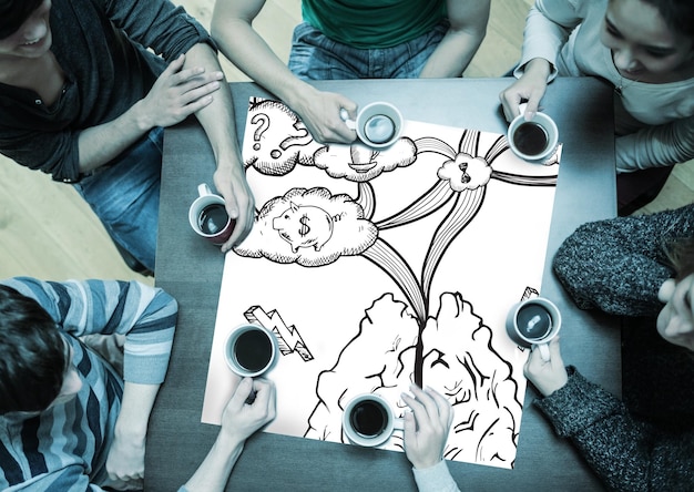 People sitting around table drinking coffee with page showing cloud computing doodle