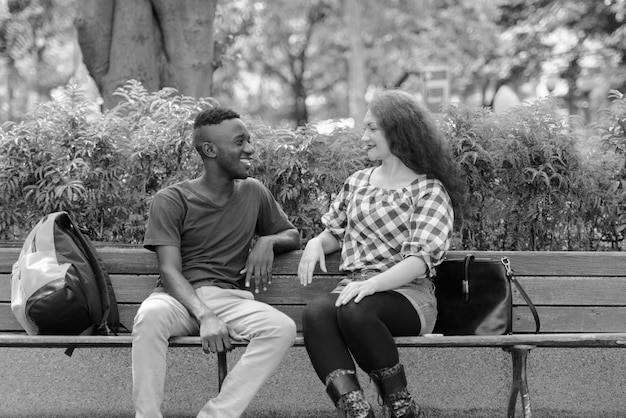 People sitting on bench in park