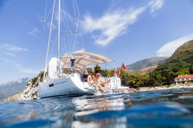 People sitting on boat against sky