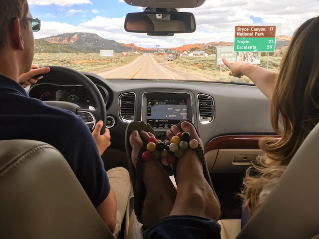 people sitting in car on road