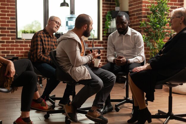 Photo people sitting on chair while having psychotherapy session