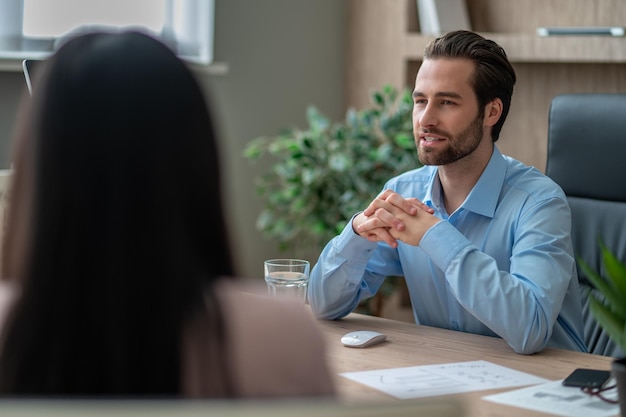 People sitting at the table and having negotiations