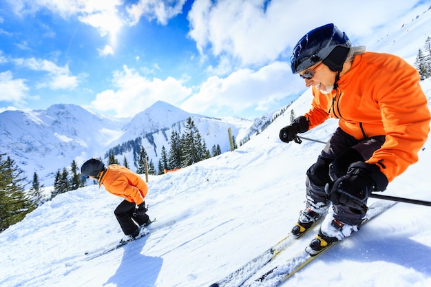 People skiing on snow covered mountain