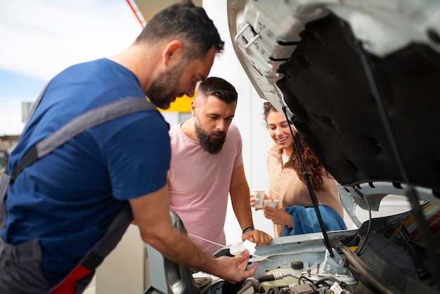 People spending time at the gas station