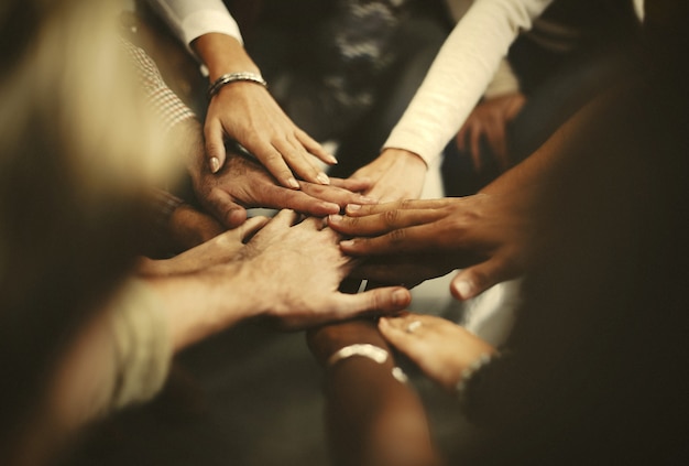 Photo people stacking hands as a team