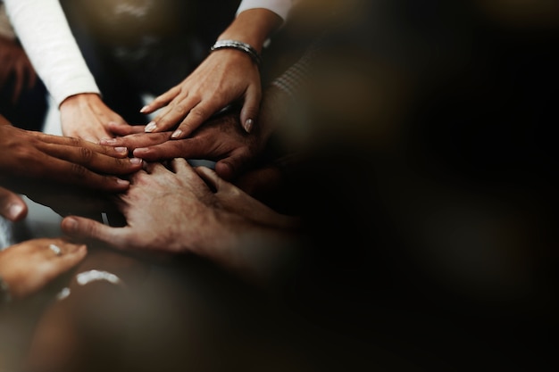 People stacking hands