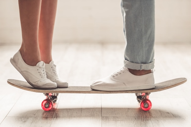 People standing closely near each other on the skateboard