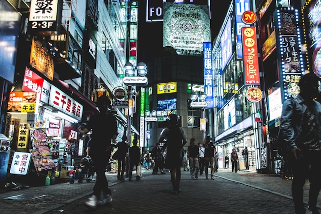 people on street amidst buildings