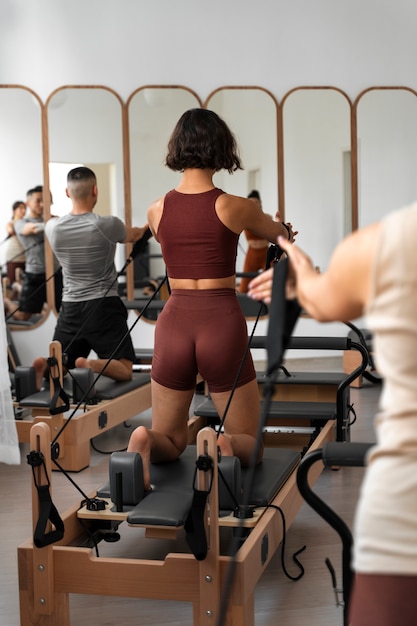 people taking  pilates reformer class