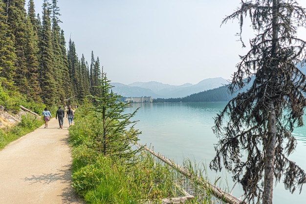 People taking a walk around lake louise in alberta