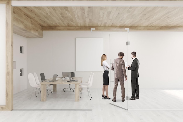 People talking in conference room with glass walls and doors