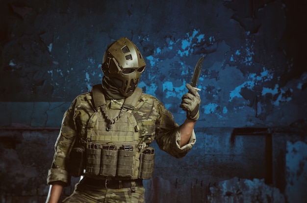 The people in uniform with weapons in the ruins