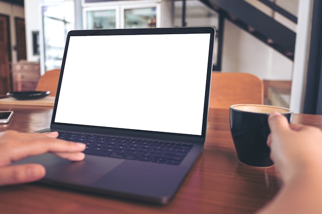 People using computer laptop with coffee cup