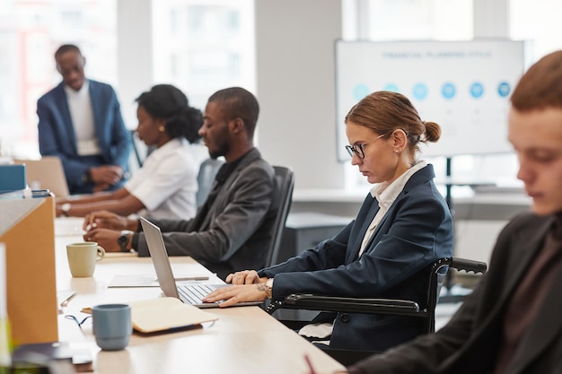 people using computers in office