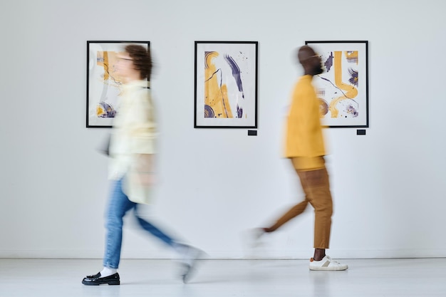 People visiting modern art gallery