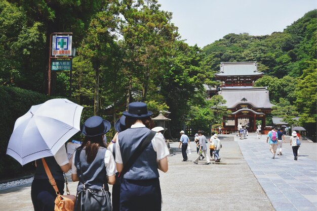 Photo people visiting tsurugaoka hachimangu against clear sky