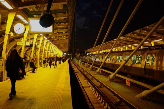 People waiting at railroad station platform