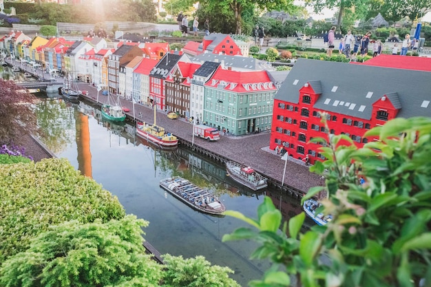 People walk in Legoland in a miniature city made of constructor