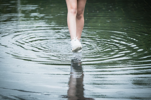 Photo people walk wading over water flood city street road after storm heavy raining couse foot bites skin disease