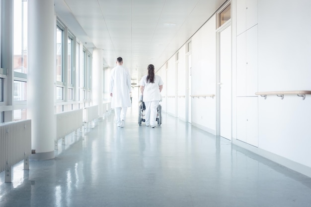 People walking in corridor of building