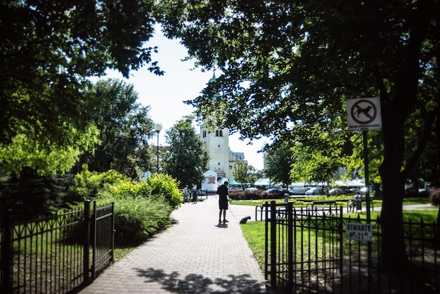 People walking dog on footpath