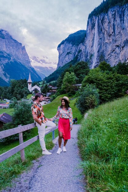 People walking on mountain against sky