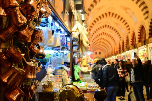 People walking and shopping inside the Spice Bazaar (Misir Carsisi) one of the largest bazaars.