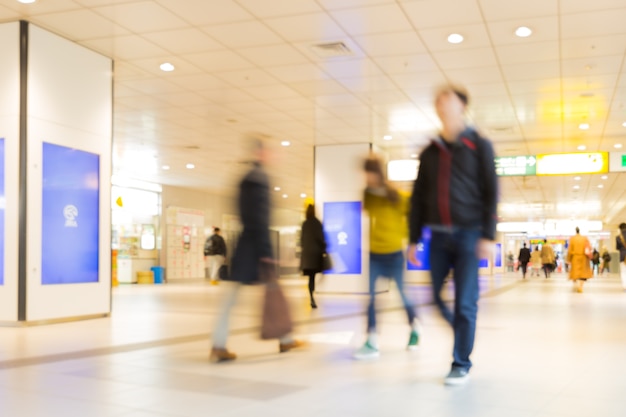 People walking in shopping mall.