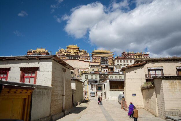 People walking on street amidst buildings in town