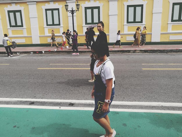 People walking on street in city