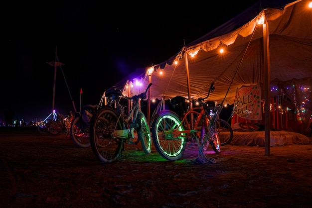 People walking towards sunset at a festival in the desert