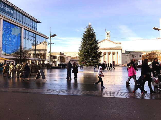 People walking in wet city