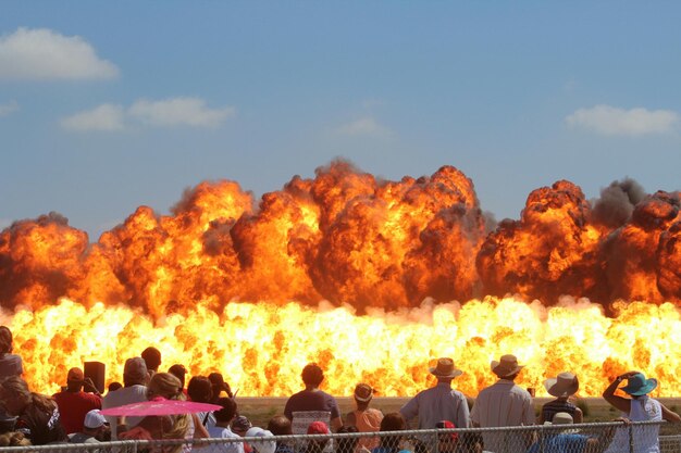 Photo people watching fire at airshow