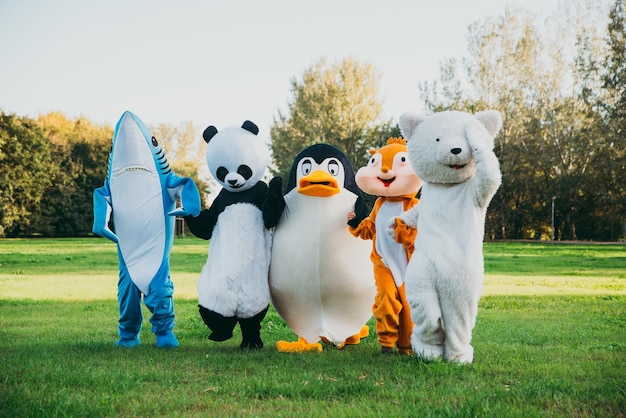 People wearing costume standing at park outdoors