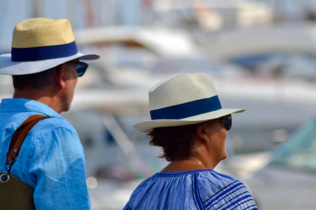 People wearing hats at harbor