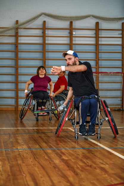 People in wheelchair playing tennis on court wheel chair tennis\
for disabled