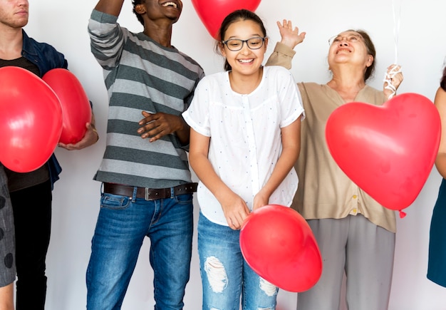 People with heart shaped balloons