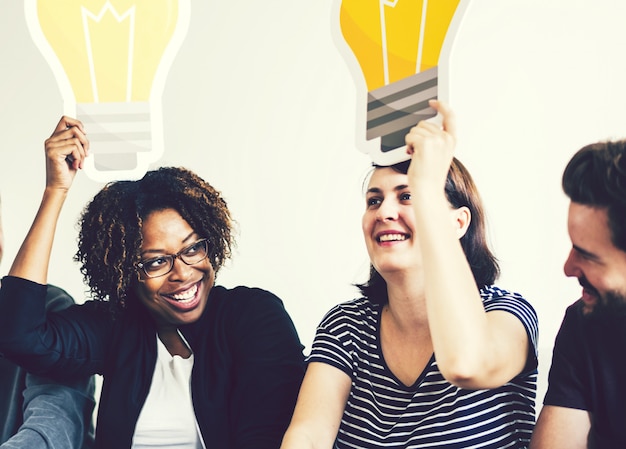 Photo people with light bulb icons over their heads