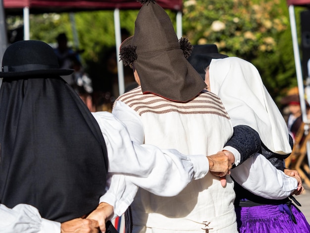 People with traditional Tenerife clothes during a typical dance of the island