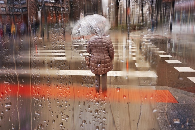 people with an umbrella in rainy days in winter season bilbao basque country spain