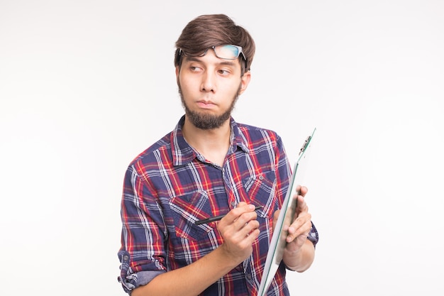 People, working and joke concept - Funny handsome bearded man with clipboard on white background