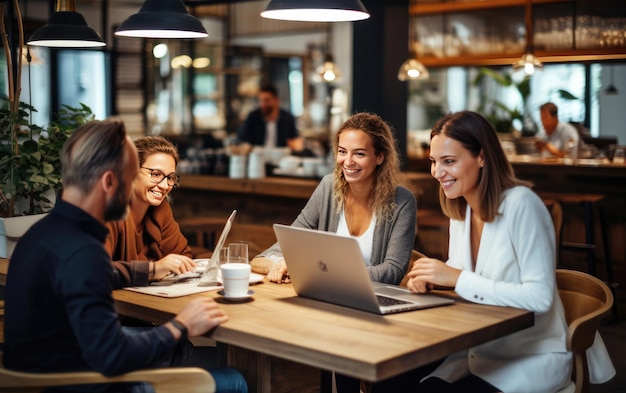 People working on laptops at a table