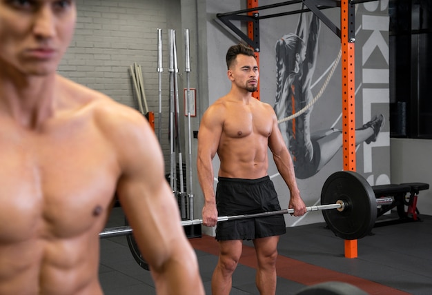 People working out indoors together with weights