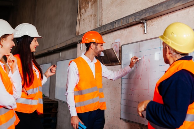 People working with orange umbrella